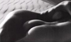 nude couple prone on beach